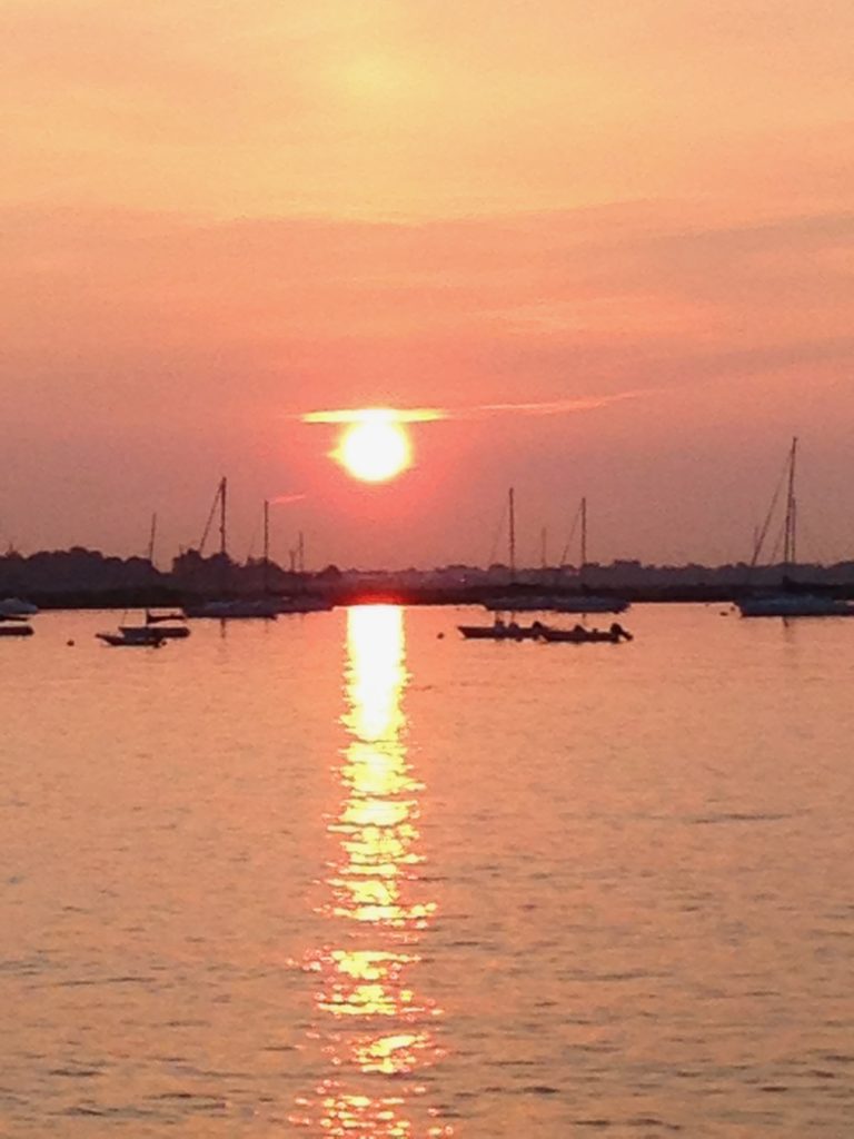 sunset and sailboats