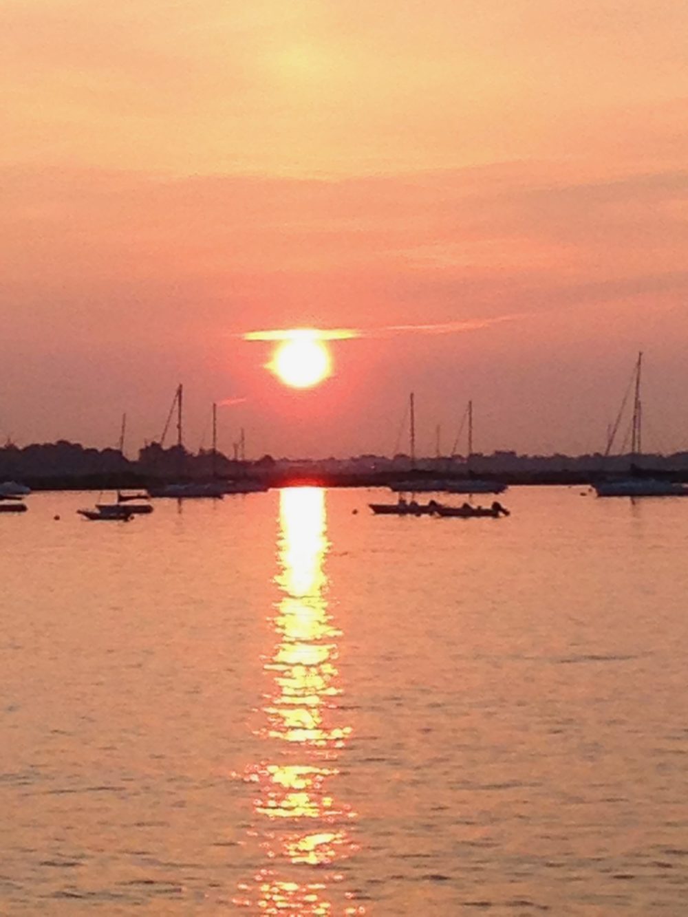sunset and sailboats