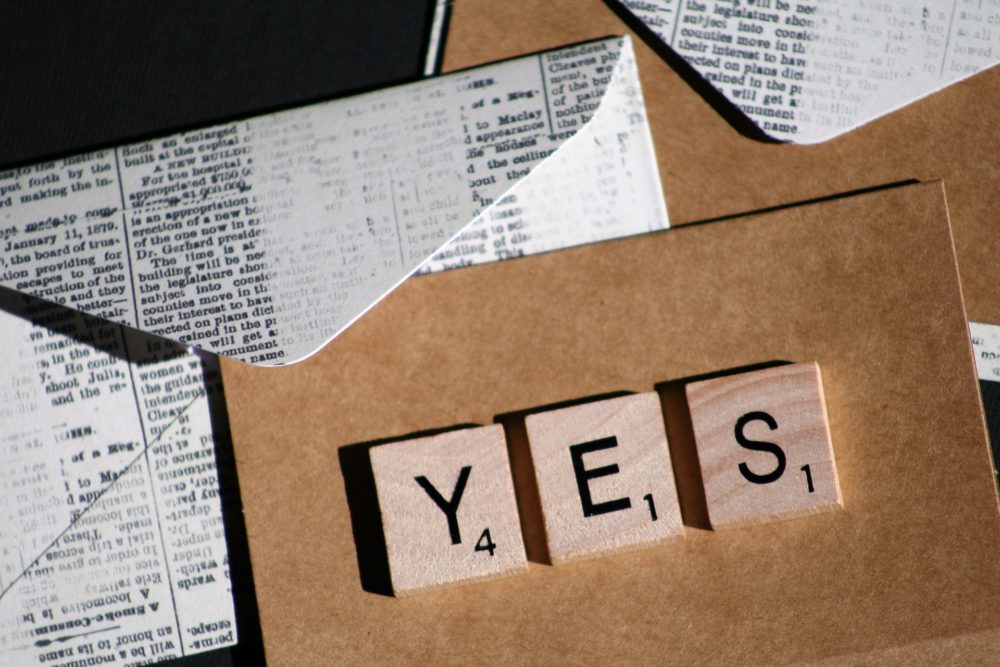 Scrabble tiles spell "yes"