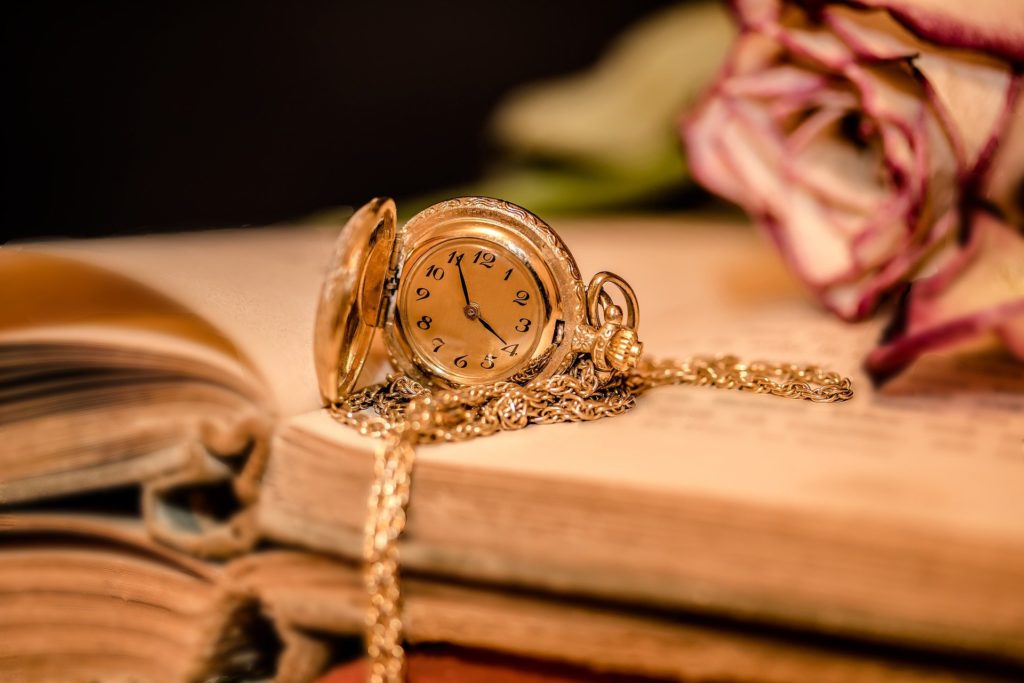 gold watch on book